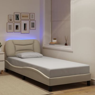 vidaXL Estrutura de cama com luzes LED 90x200 cm tecido cor creme